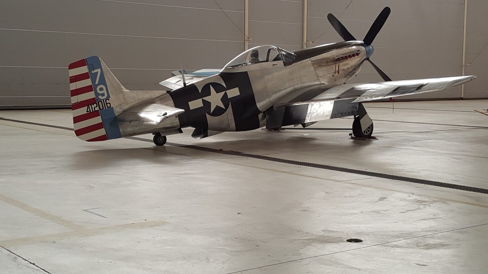 P-51 Mustang warbird in a hangar
