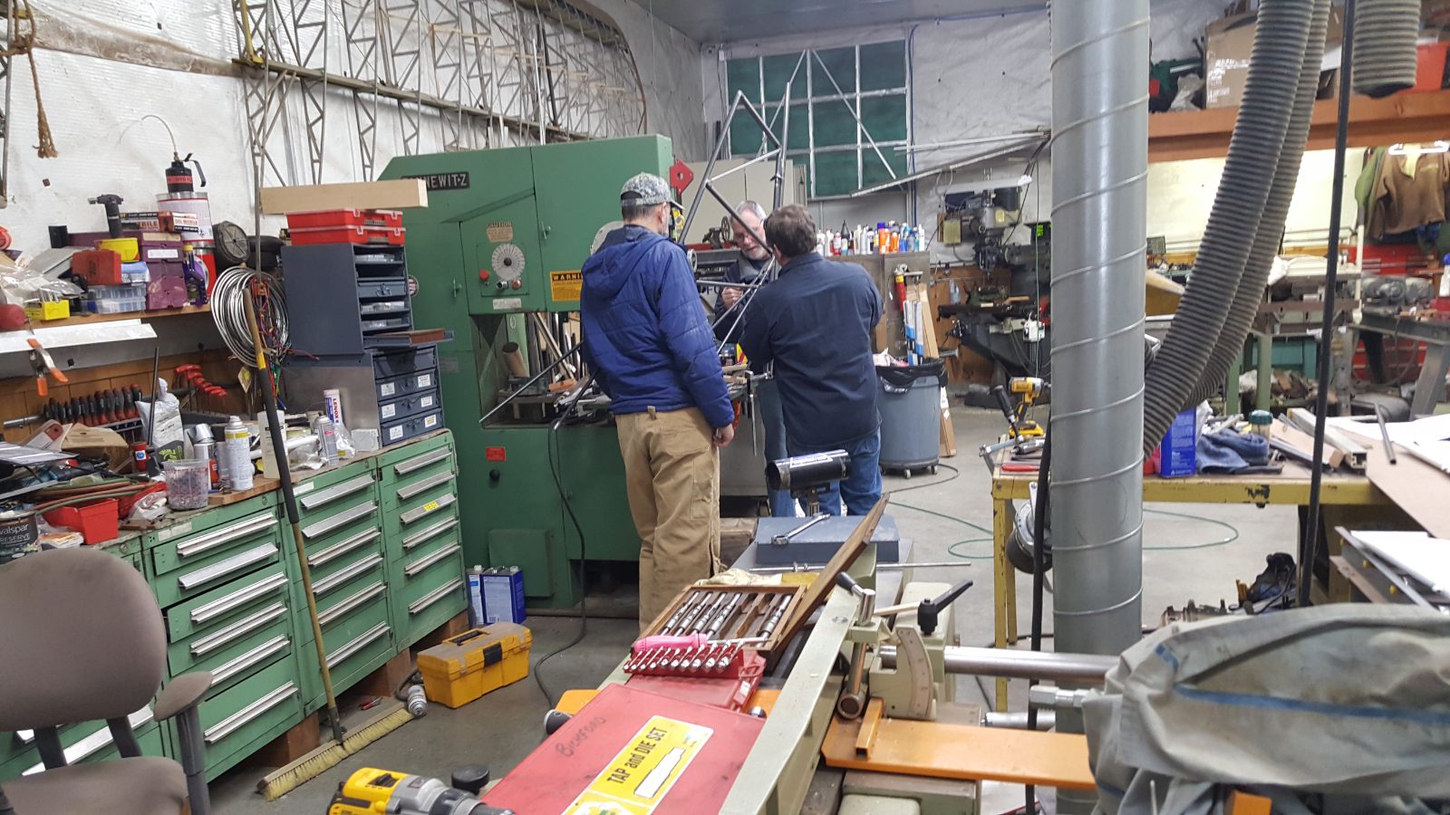 Ron Edson and others working in an aircraft maintenance shop